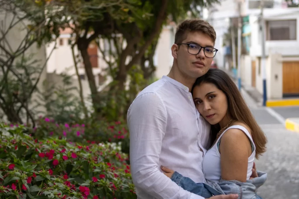 Happy couple taking a photo together in Arequipa, one of the most charming Peru honeymoon destinations.