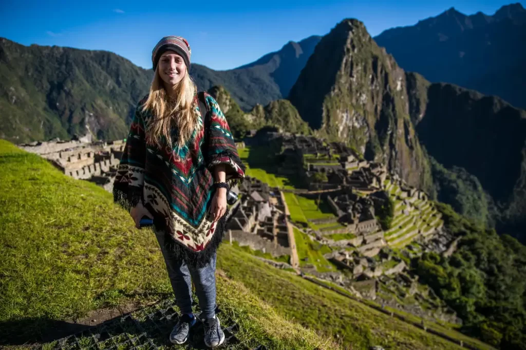 glamping in peru for couples machu picchu viewpoint Woman posing at the Machu Picchu viewpoint during a romantic glamping in Peru for couples experience