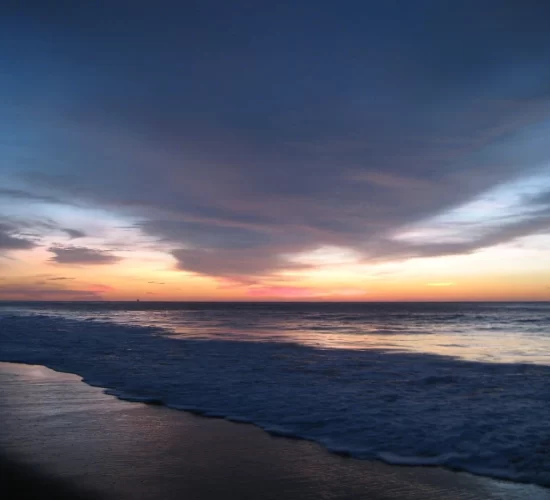 Golden sunset over Máncora Beach, perfect for a romantic Peru honeymoon getaway.