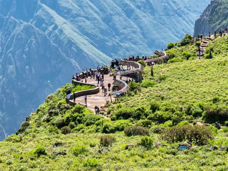 Couples enjoying panoramic views at Cruz del Cóndor during a Colca Canyon honeymoon tour in Peru