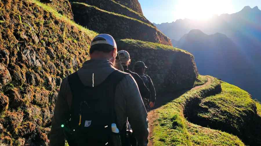 Couple beginning their sunrise ascent on Day 2 of their luxury glamping Inca Trail honeymoon