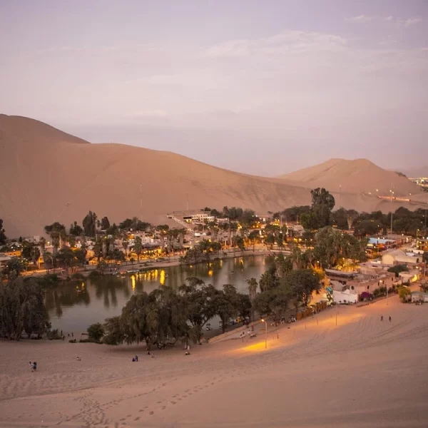 Huacachina oasis at sunset during a Luxury Peru Coast honeymoon tour