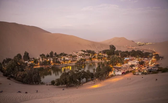 Huacachina oasis at sunset during a Luxury Peru Coast honeymoon tour