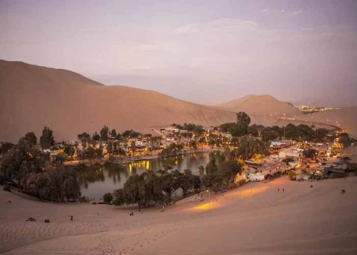 Huacachina oasis at sunset during a Luxury Peru Coast honeymoon tour