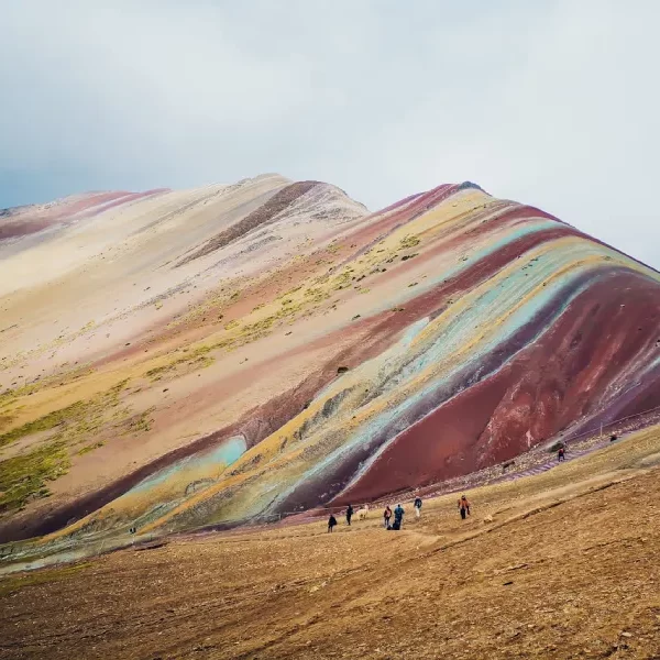 Luxury Rainbow Mountain honeymoon tour backdrop at Vinicunca in the Peruvian Andes