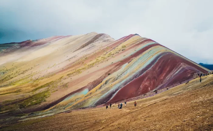 Luxury Rainbow Mountain honeymoon tour backdrop at Vinicunca in the Peruvian Andes