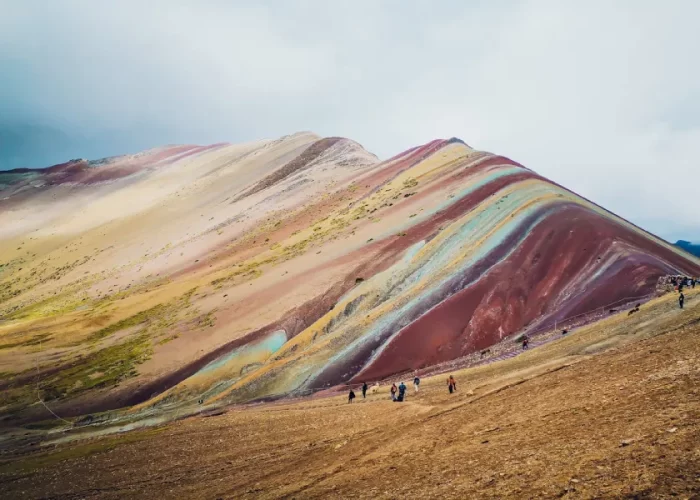 Luxury Rainbow Mountain honeymoon tour backdrop at Vinicunca in the Peruvian Andes