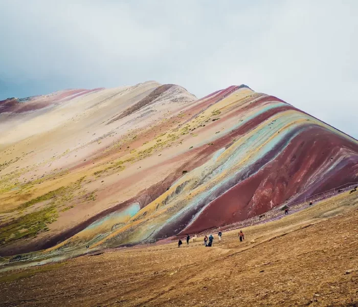 Luxury Rainbow Mountain honeymoon tour backdrop at Vinicunca in the Peruvian Andes