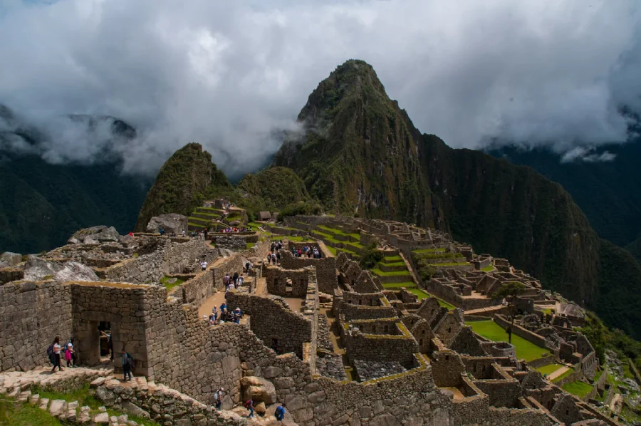 Exploring Machu Picchu’s stone ruins during a private guided visit on a Machu Picchu honeymoon tour